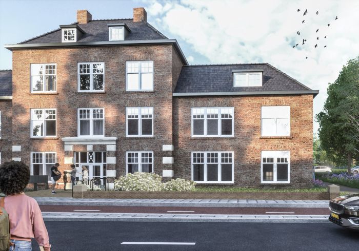 Impressie van een gerenoveerd of nieuwgebouwd pand met klassieke bakstenen gevel en witte kozijnen in Helmond, met mensen die voor het gebouw staan en een geparkeerde auto aan de straatkant.