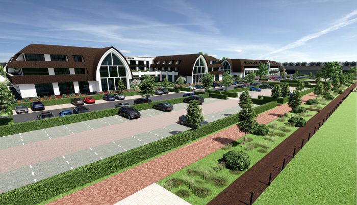 Impressie van de parkeerplaats van het nieuwgebouwde Van der Valk Exclusief Hotel Gouden Leeuw in Voorschoten, met parkeervakken en zicht op de hotelgevel.