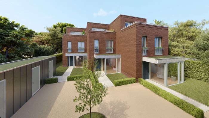 Nieuwbouw Kovelaar Utrecht: bakstenen stadswoningen met glazen uitbouwen, hagen en zonniger patio’s.