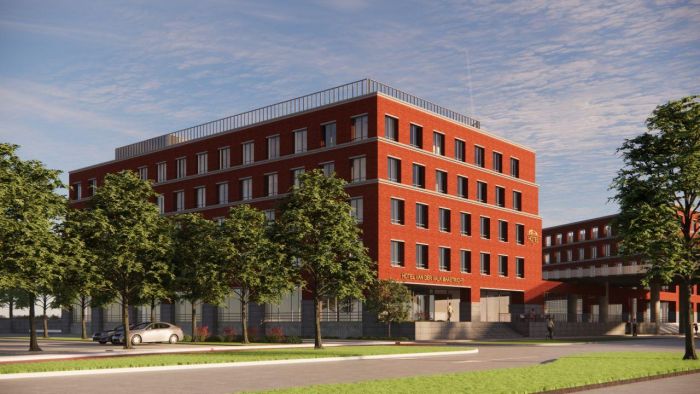 Impressie Van der Valk Maastricht-Maas: hoekgebouw in rode baksteen met entree aan plein.