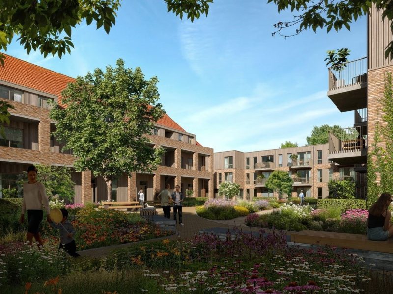 Impressie van de groene binnentuin van het nieuwbouwproject De Laak in Eindhoven, onderdeel van het moderne appartementencomplex.